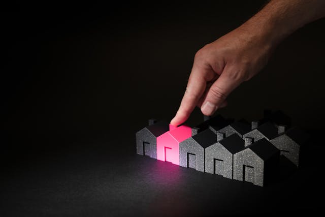 a%20finger%20pointing%20to%20a%20red%20house%20amidst%20a%20number%20of%20black%20ones a%20finger%20pointing%20to%20a%20red%20house%20amidst%20a%20number%20of%20black%20ones